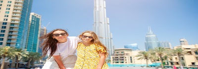 happy-family-walking-dubai-with-skyscrapers.jpg